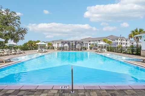 A large swimming pool with a depth marker in the middle.