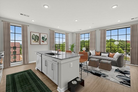 A modern kitchen with a large island and a view of the city.