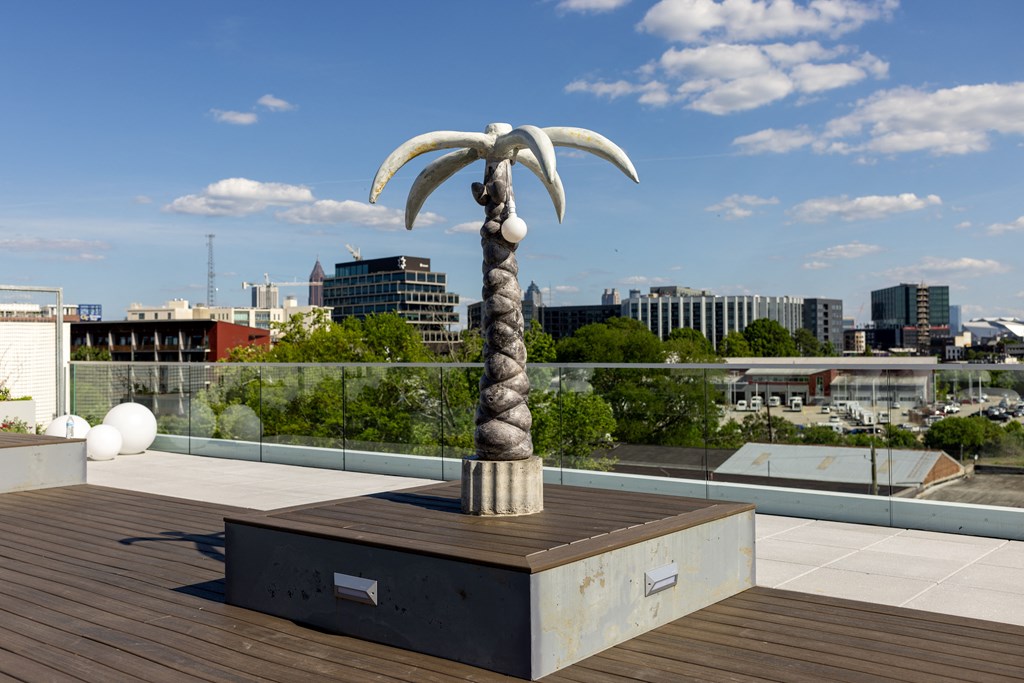 a sculpture of a palm tree on top of a rooftop