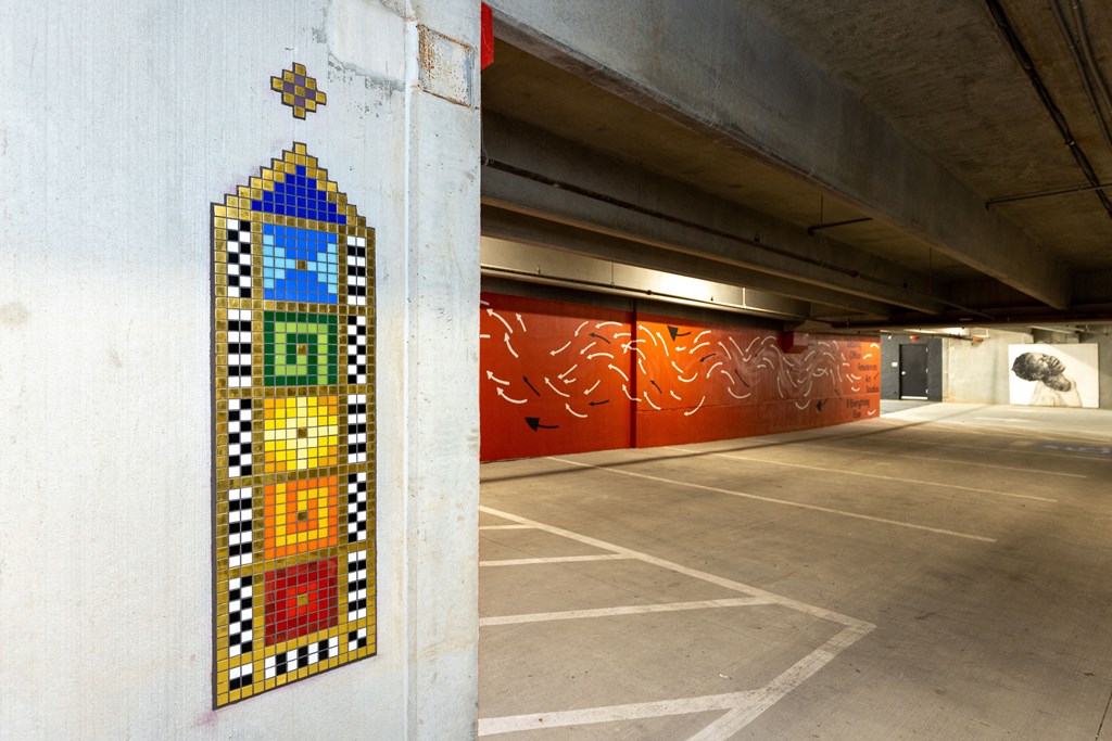 a painting on a wall in a parking garage