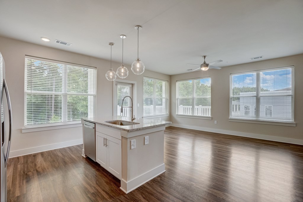 an empty kitchen and living room