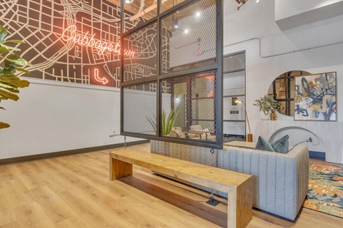 a living room with a couch and a wooden bench