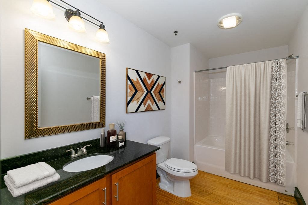 a bathroom with a sink toilet and a shower