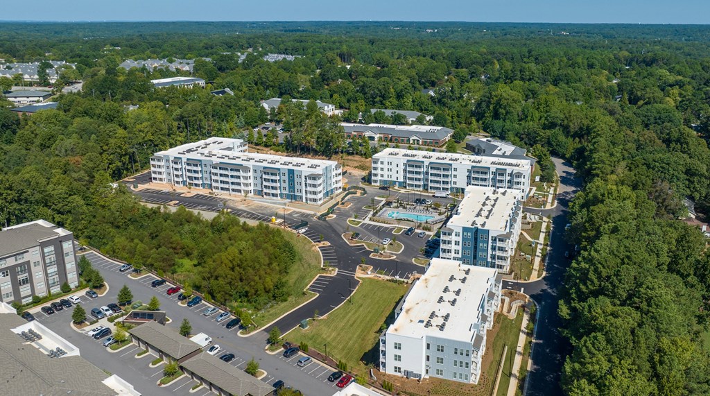 an aerial view of a city with buildings and trees