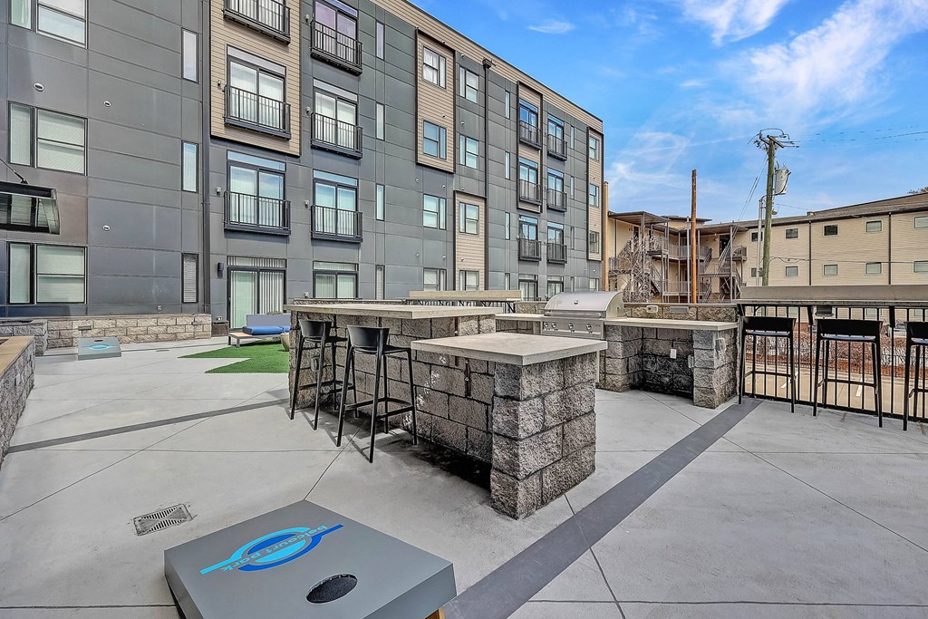 our apartments showcase a naturally well lit living area with a fire pit