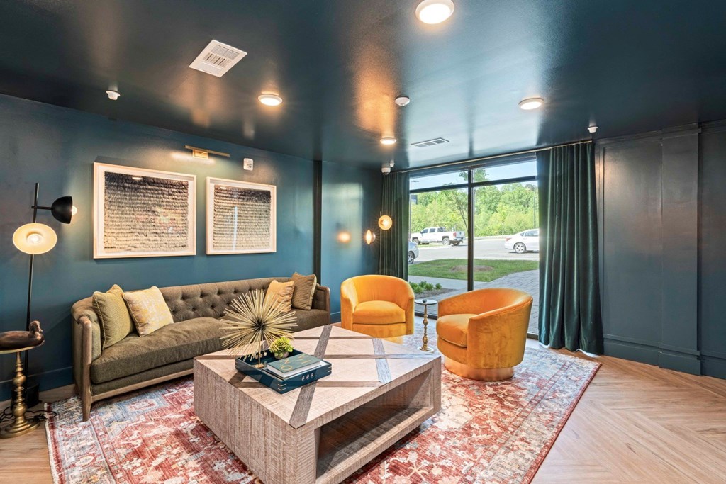 a living room with blue walls and a couch and a coffee table