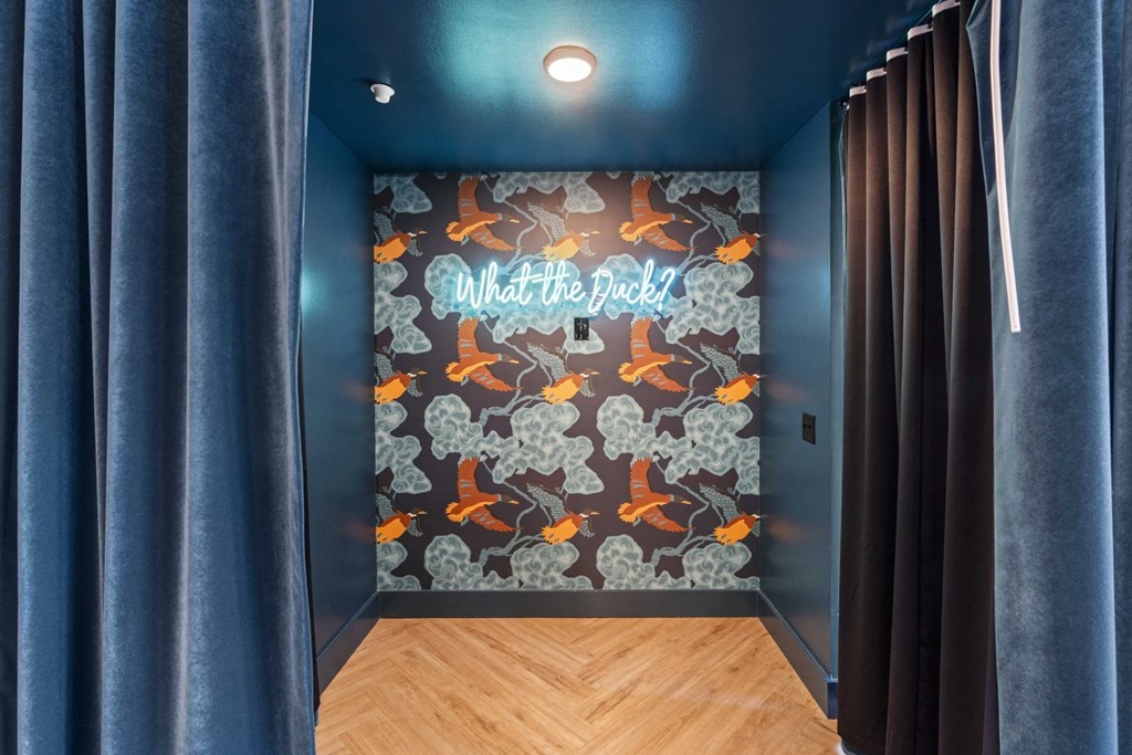 a mural in a room with blue walls and a wood floor