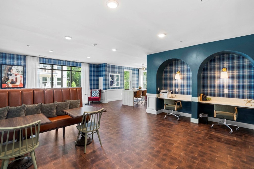 a conference room with tables and chairs and blue and white walls