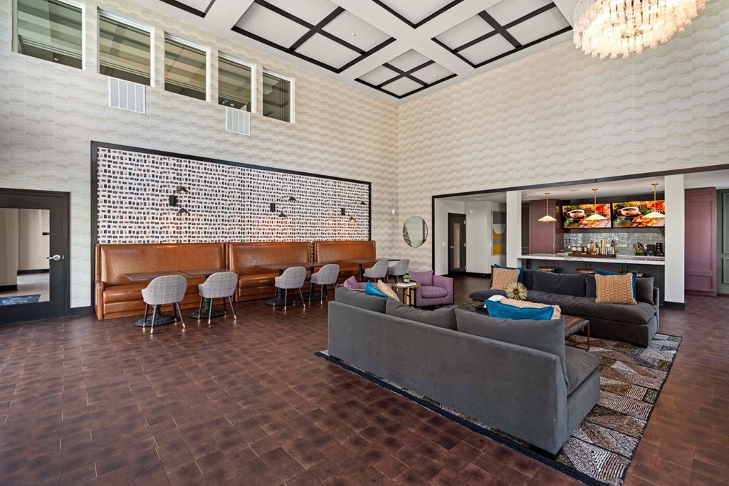 a living room with a couch and a bar in the corner