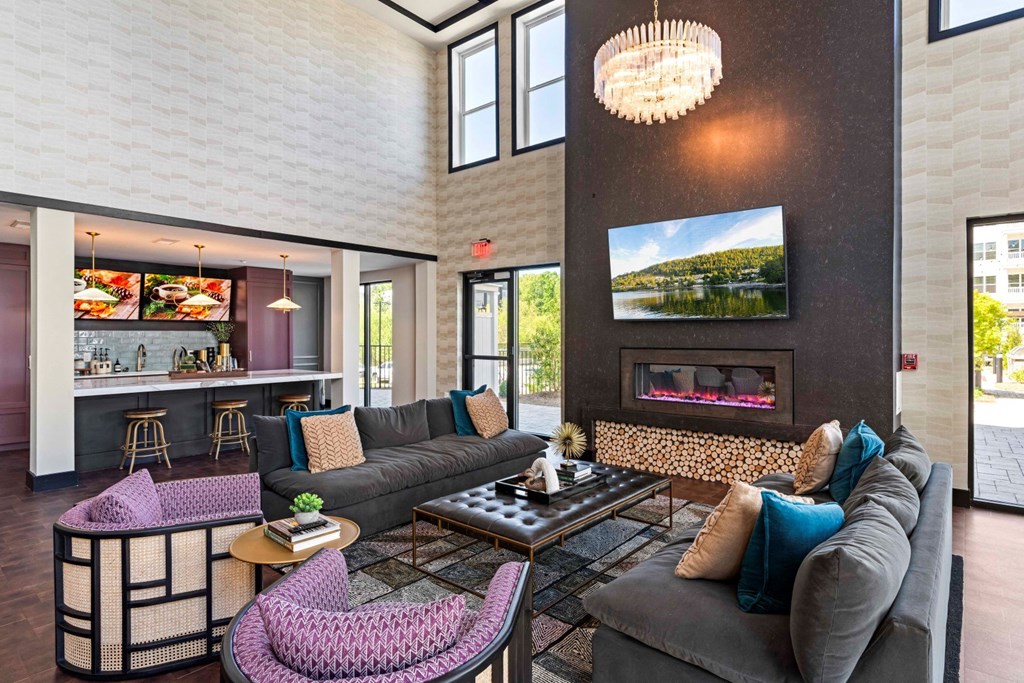 a living room with couches and a fireplace