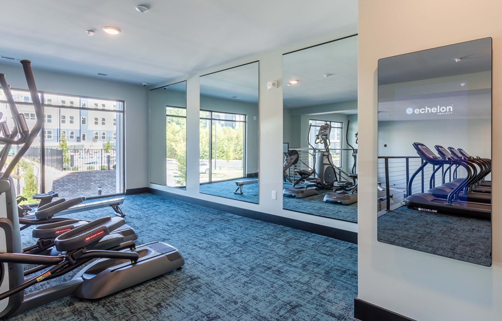the gym at the district flats apartments in lenexa