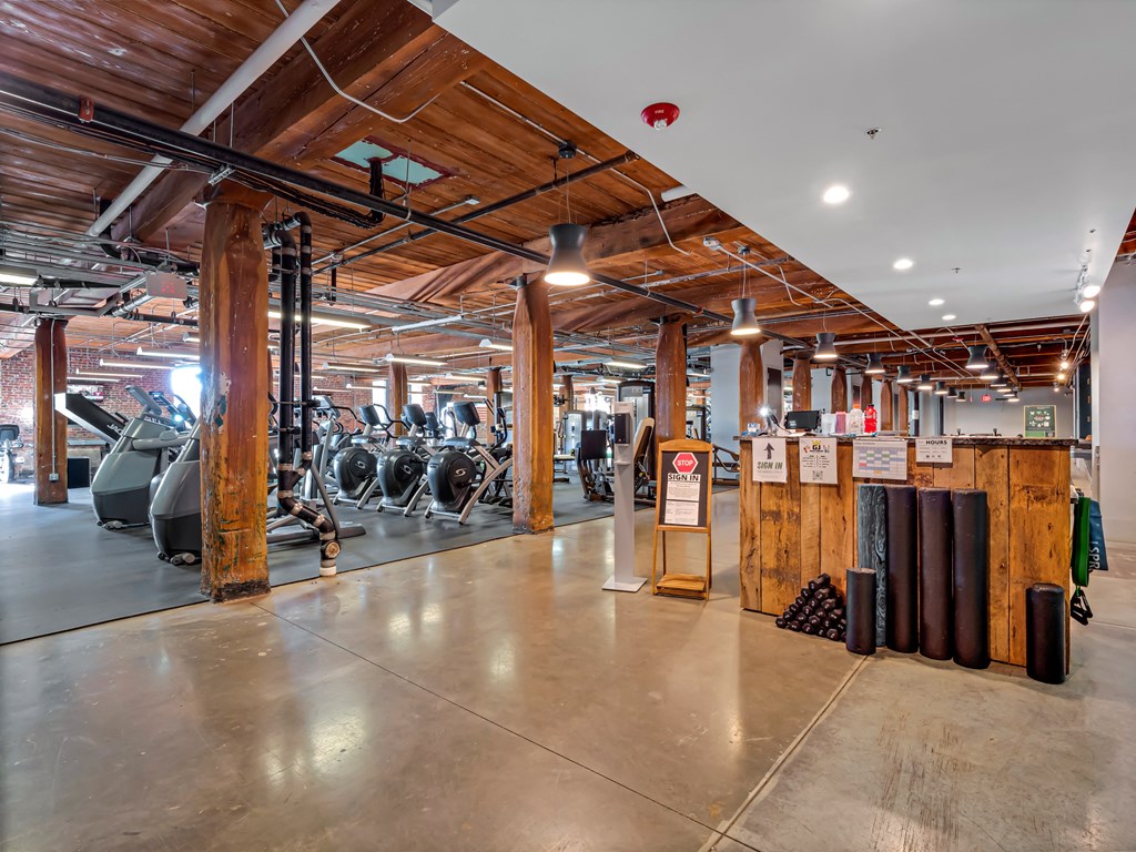 the gym atrium with treadmills and other exercise equipment