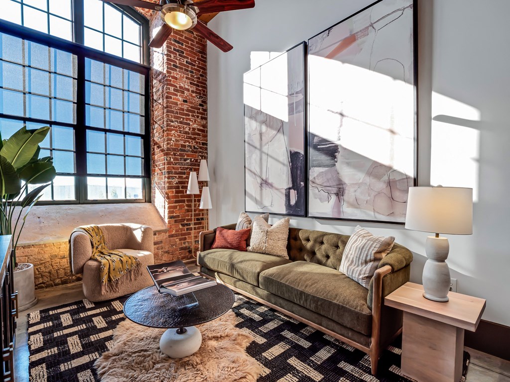 a living room with a couch and a large window