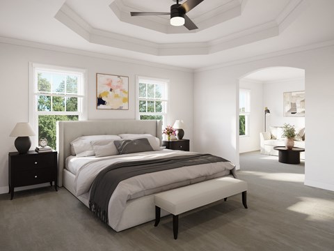 a bedroom with white walls and a coffered ceiling