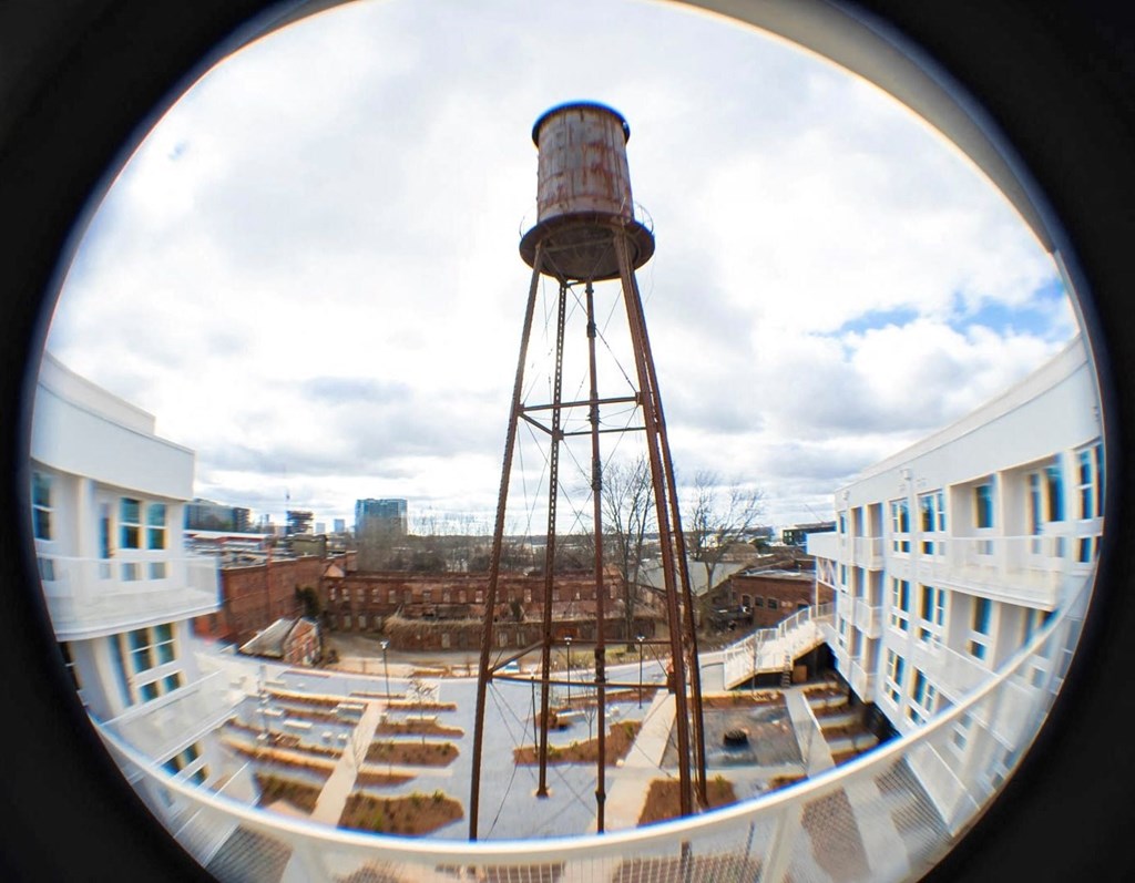 a view of a water tower on top of a building