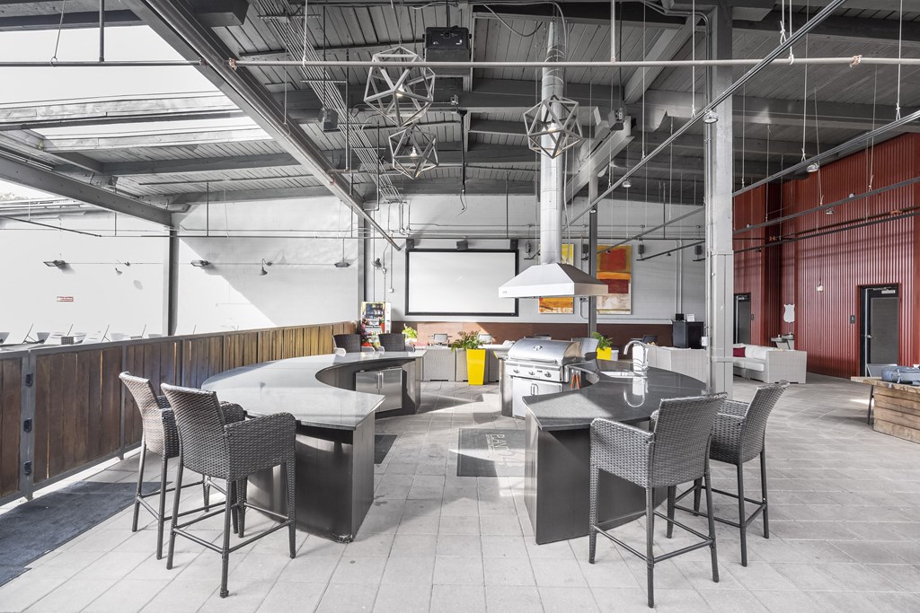 a large kitchen and dining area with tables and chairs