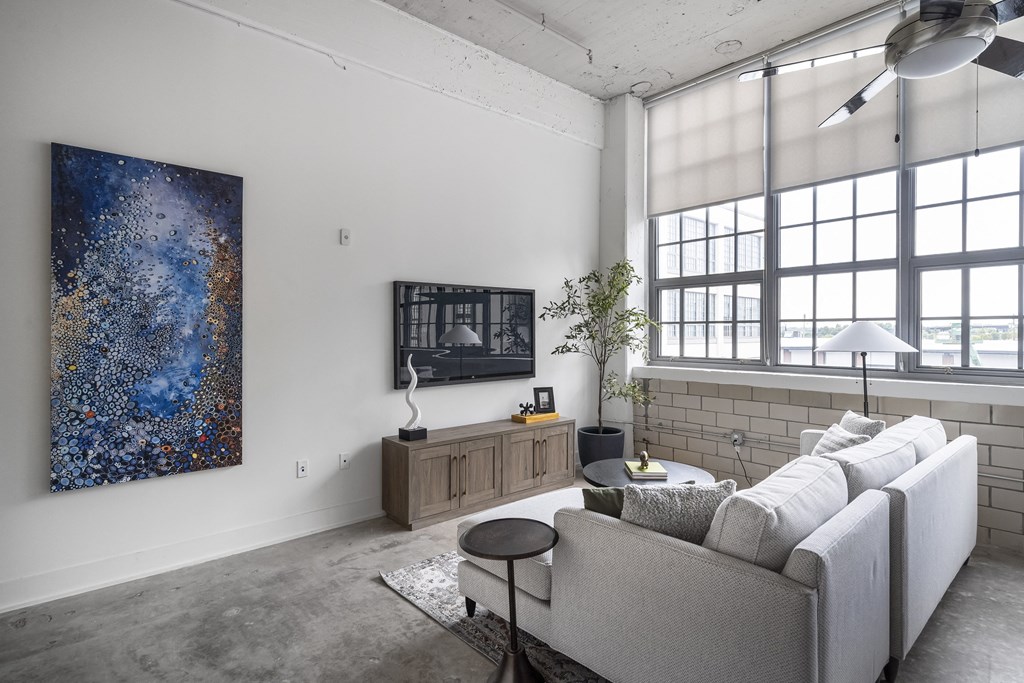 an open living room with a couch and a coffee table