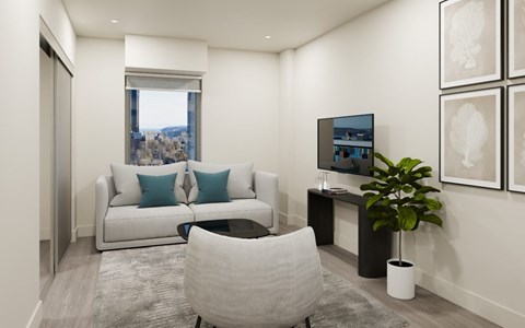 A living room with a white couch, a grey chair, and a television.