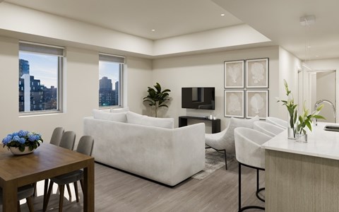 A modern living room with a white couch and a wooden table.