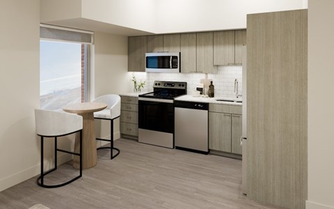 A modern kitchen with a black stove top oven and a microwave above the stove.