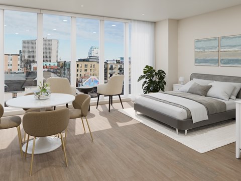 A modern bedroom with a large bed and a view of the city.