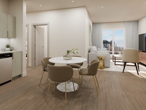 A modern dining room with a round table and chairs.
