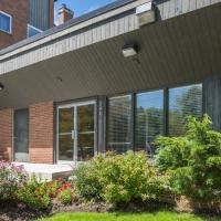 the front of a house with windows and a porch