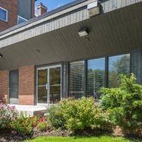 the front of a house with windows and a porch