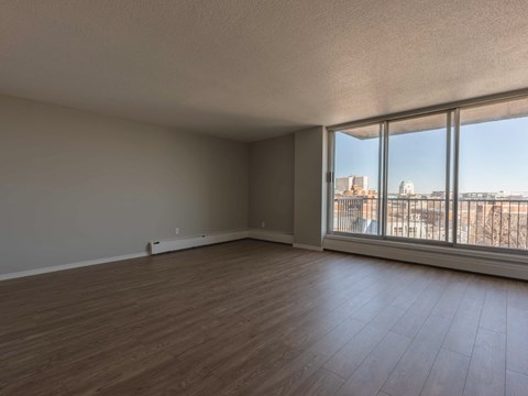 Empty room with a view of the city through the window.
