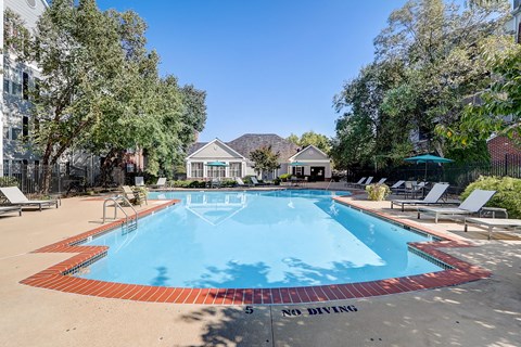 the preserve at ballantyne commons resort style pool with chairs and trees