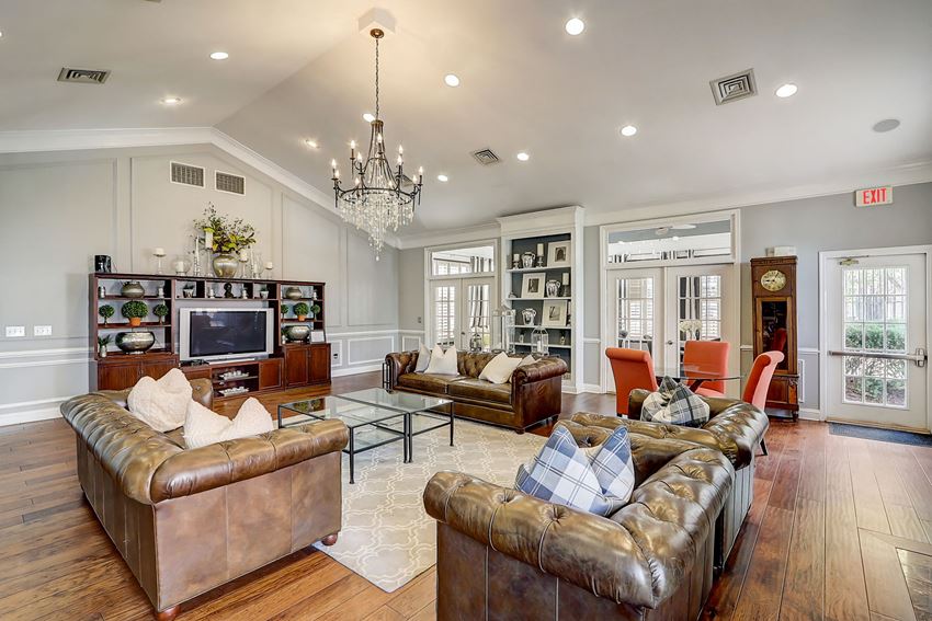 Resident Clubhouse with Entertainment Area a living room with couches and a tv - Photo Gallery