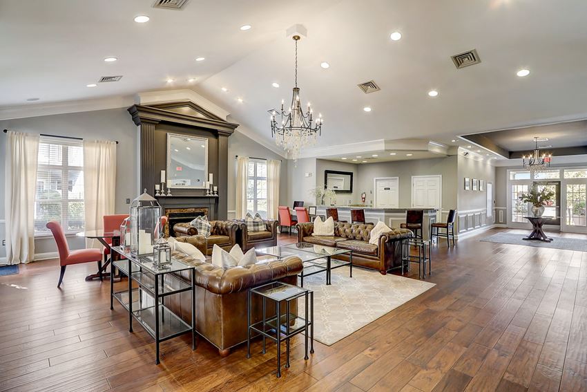 a large living room with couches and a table with chairs - Photo Gallery