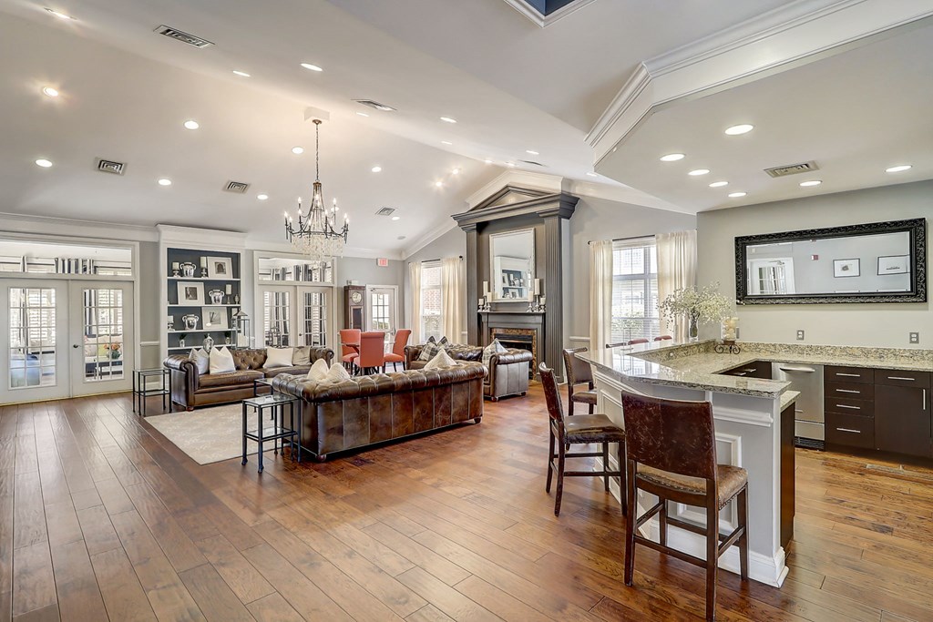 a large living room with a kitchen and a dining room
