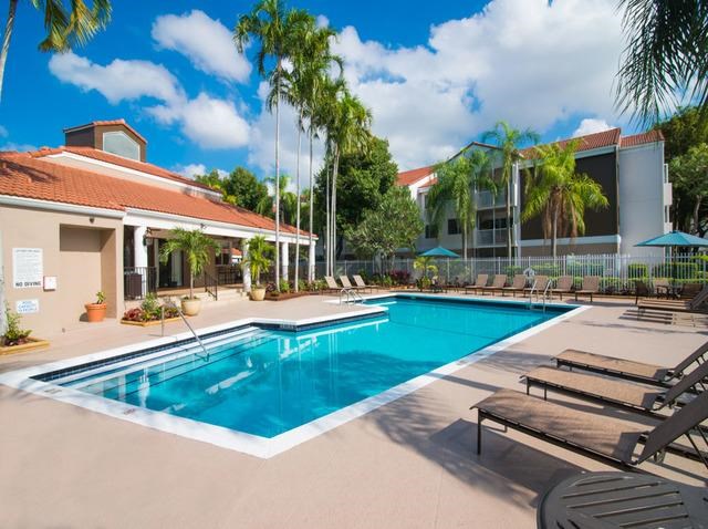 a swimming pool in front of a building