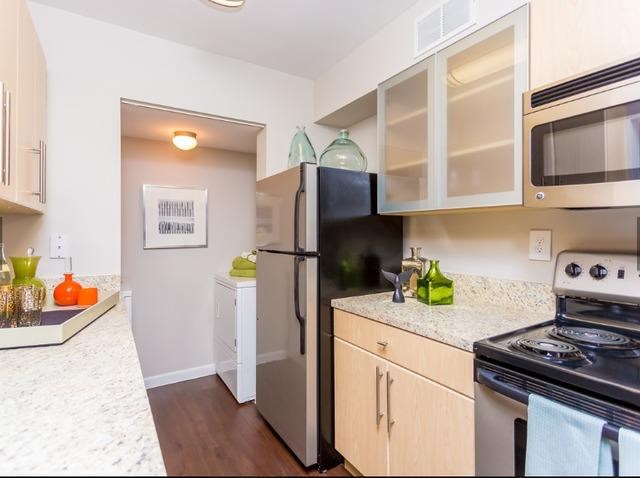 a kitchen with a stove and a refrigerator