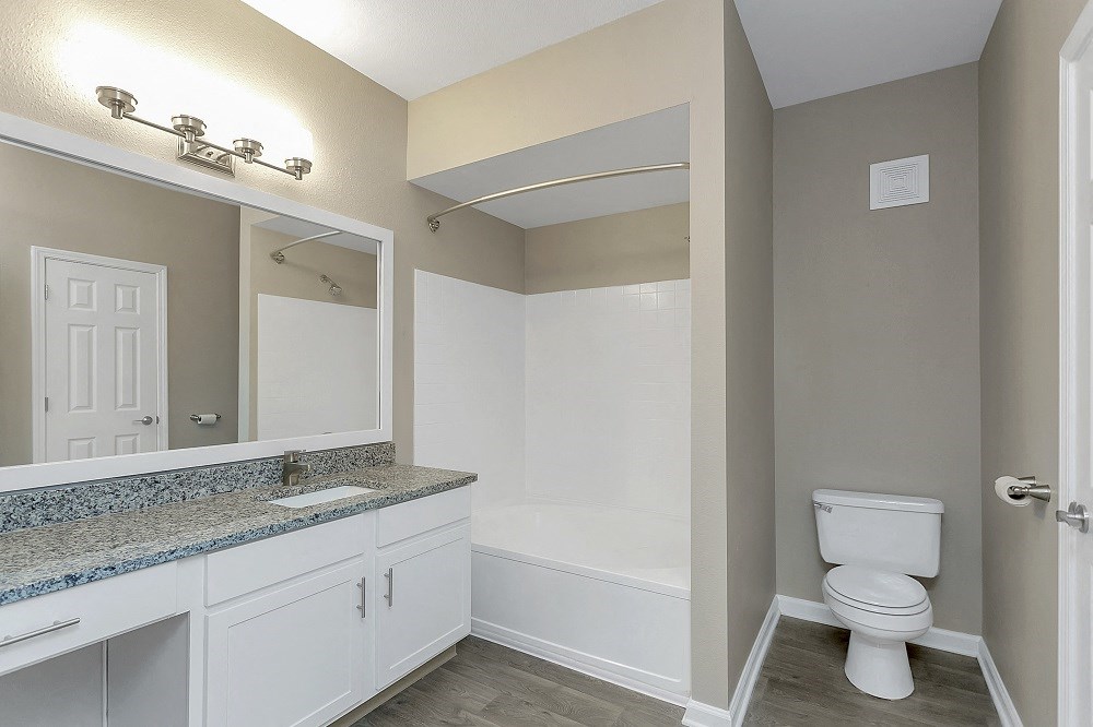 an empty bathroom with a toilet and a sink
