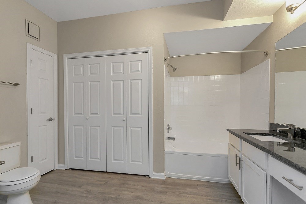 an empty bathroom with a toilet and a sink