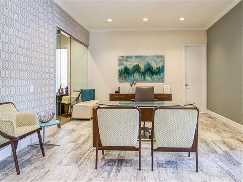a dining room with a table and chairs