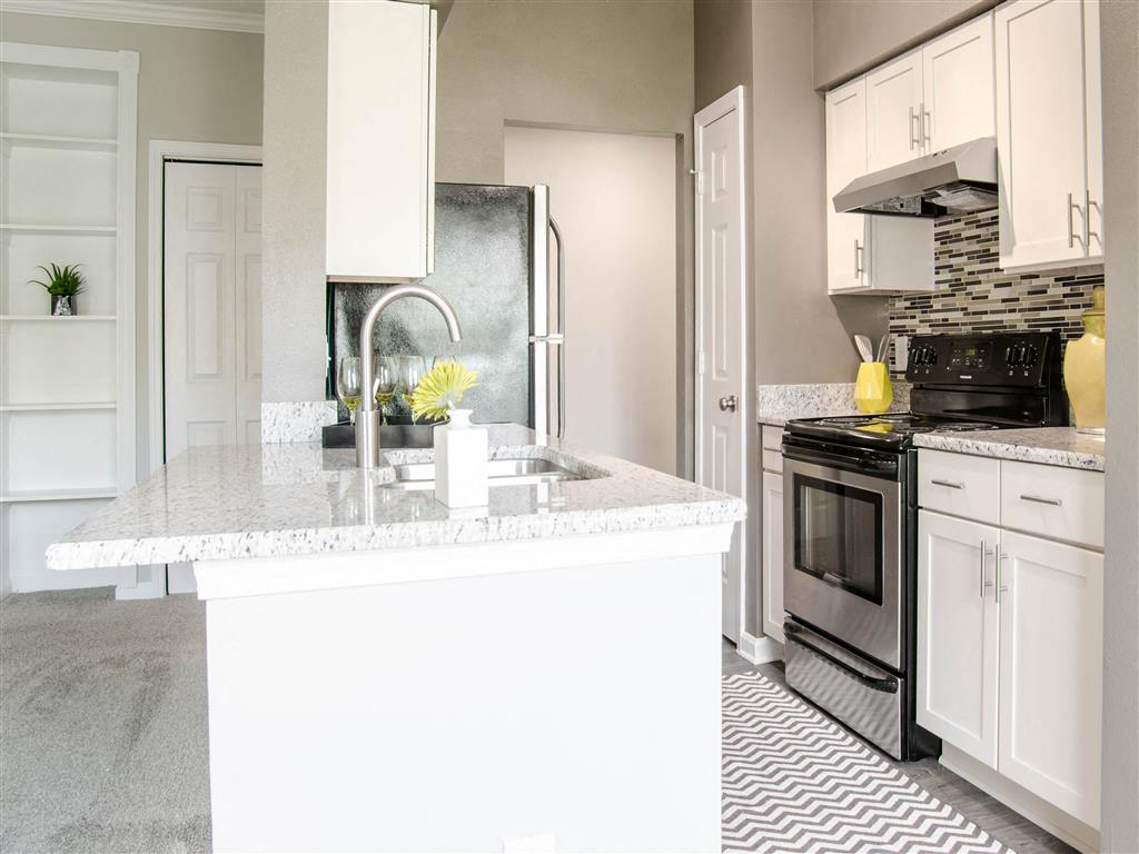 Harpeth River Oaks - White Kitchen with Granite Countertops and Stainless Steel Appliances