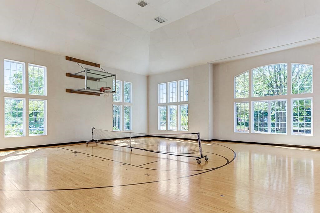 an empty room with a basketball court in the middle