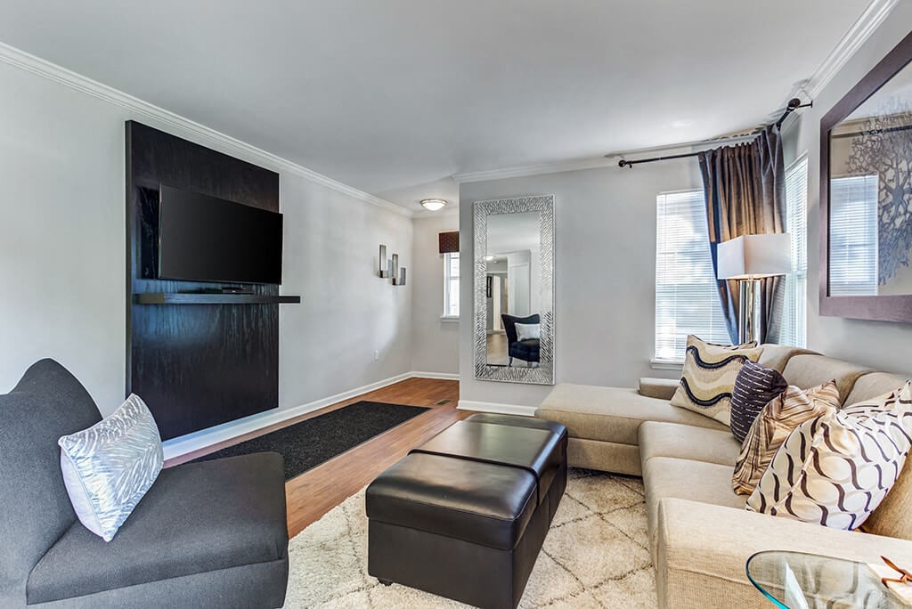 a living room with a couch and a tv