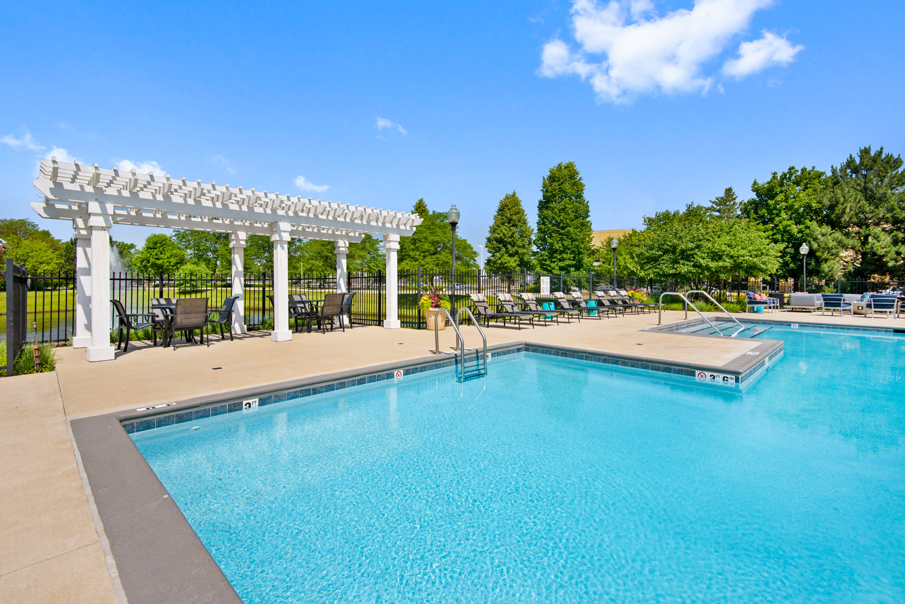 803 Corday at Naperville - Sparkling Pool with Lounge Chairs and Tables