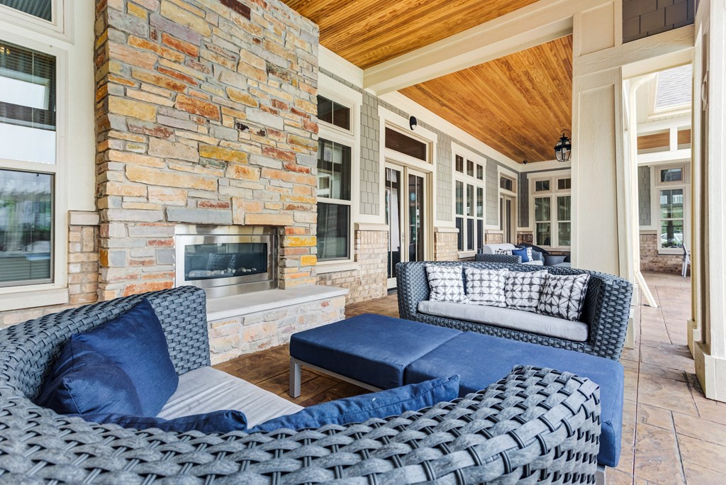 Apartments For Rent In Vernon Hills, IL - The Oaks of Vernon Hills - Outdoor Lounge Outside Resident Clubhouse With Plush Seating And Gas Fireplace