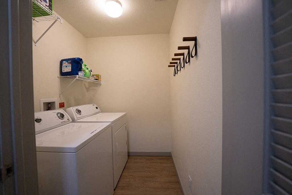 a laundry room with a washer and dryer in it