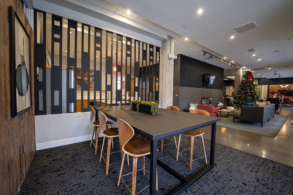 a dining room table with chairs in a lobby