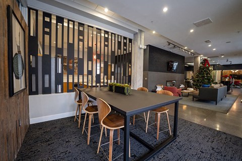 a dining room table with chairs in a lobby