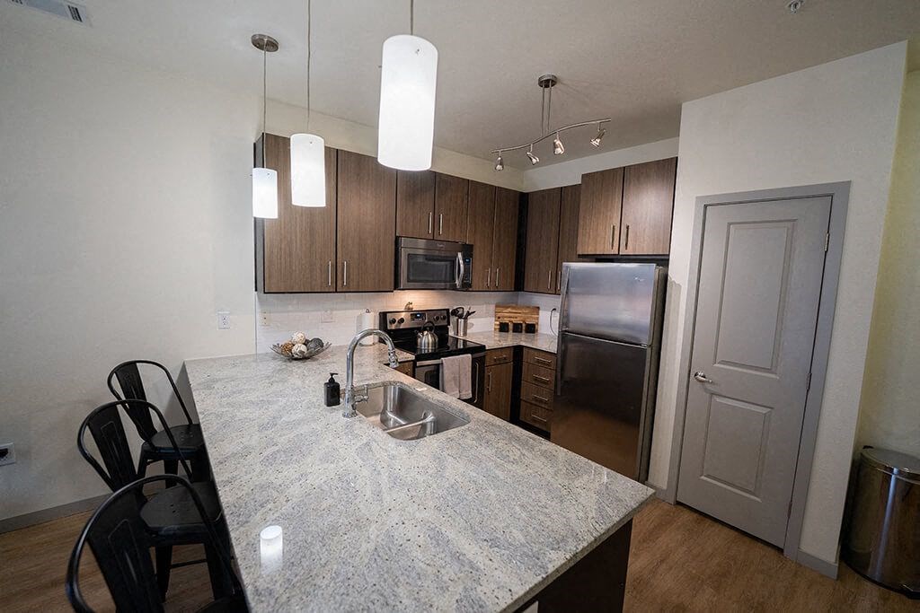 a kitchen with a granite counter top