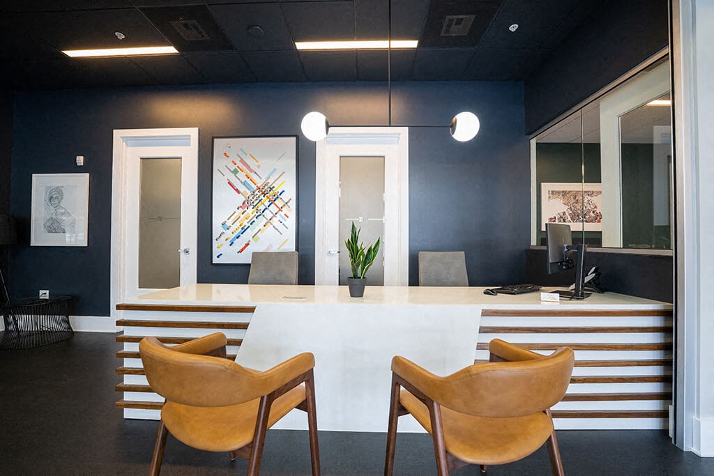 a conference room with a white table and chairs