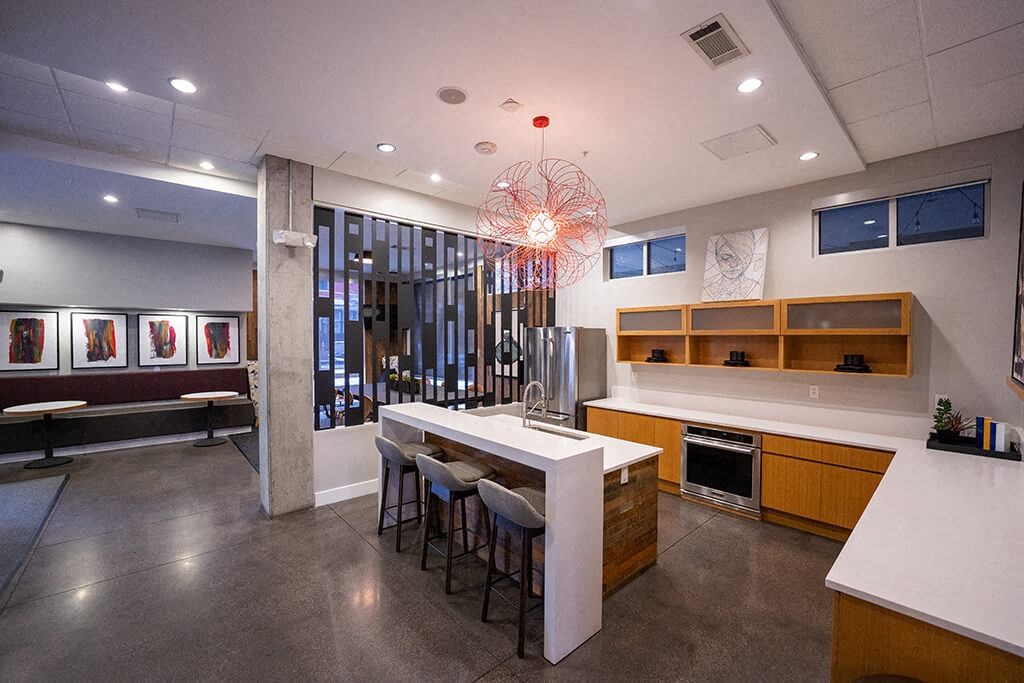 a kitchen and dining room with a table and chairs