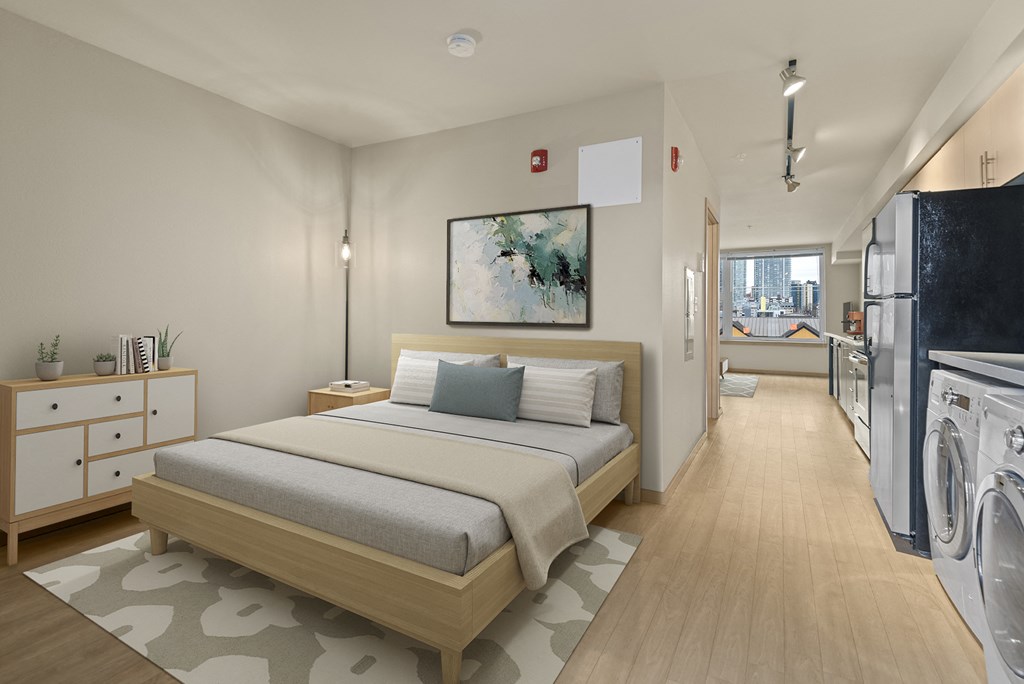 A bedroom with a bed, nightstand, and a painting on the wall.